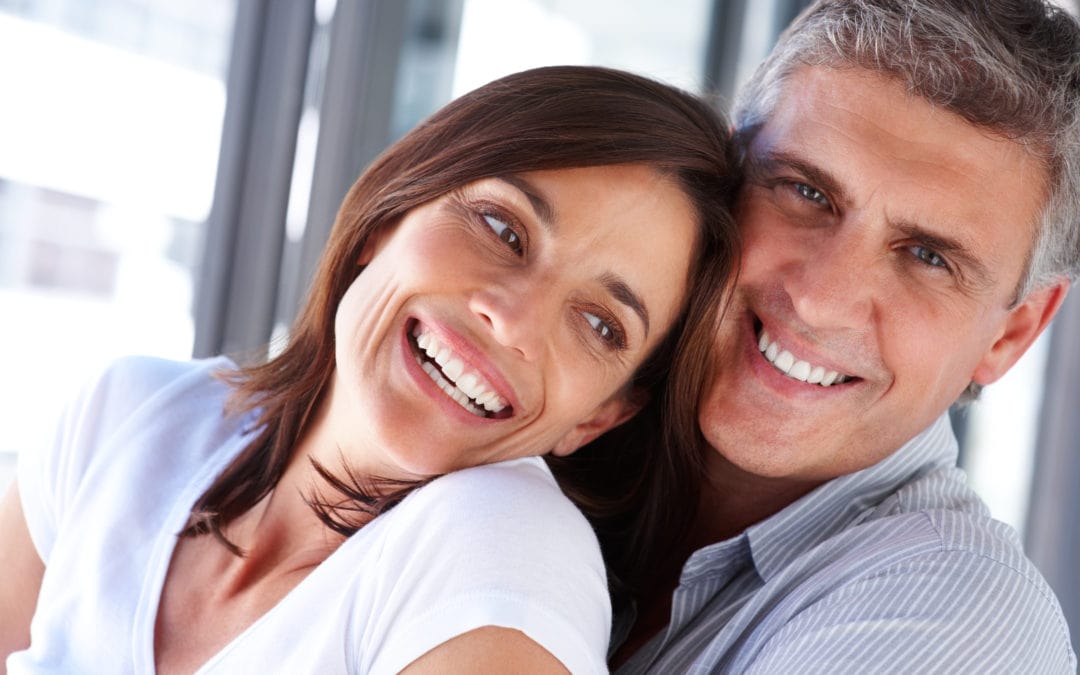 Couple smiling cheek to cheek photo