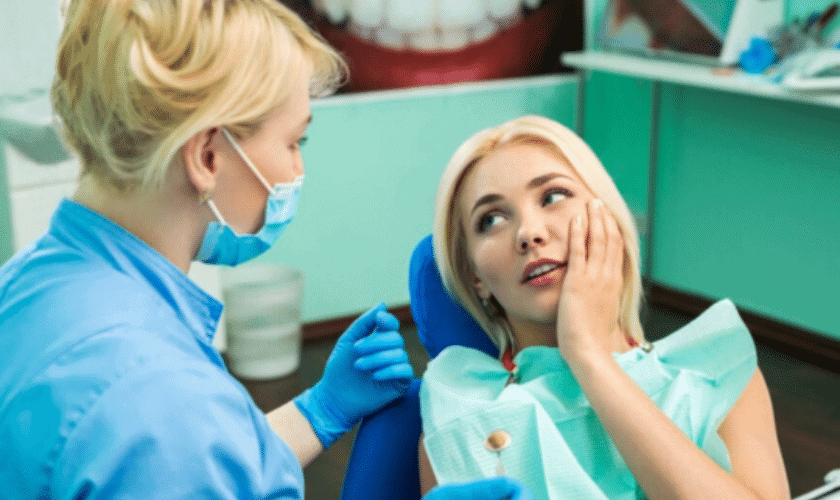 Blonde woman lying back during dental exam