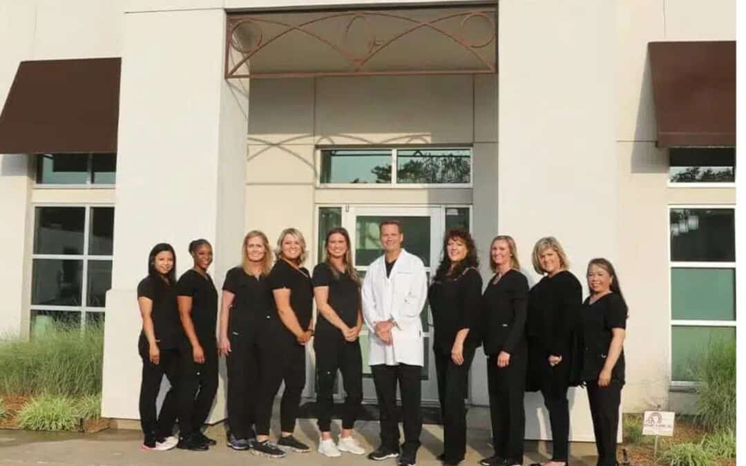 Utica Dental team standing outside office