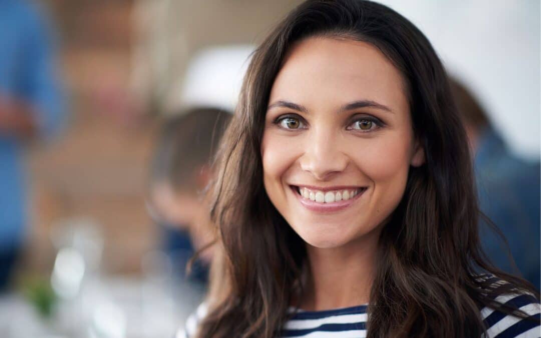 Woman smiling after scaling