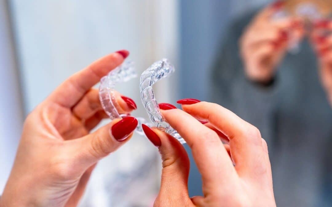 Women holding invisalign